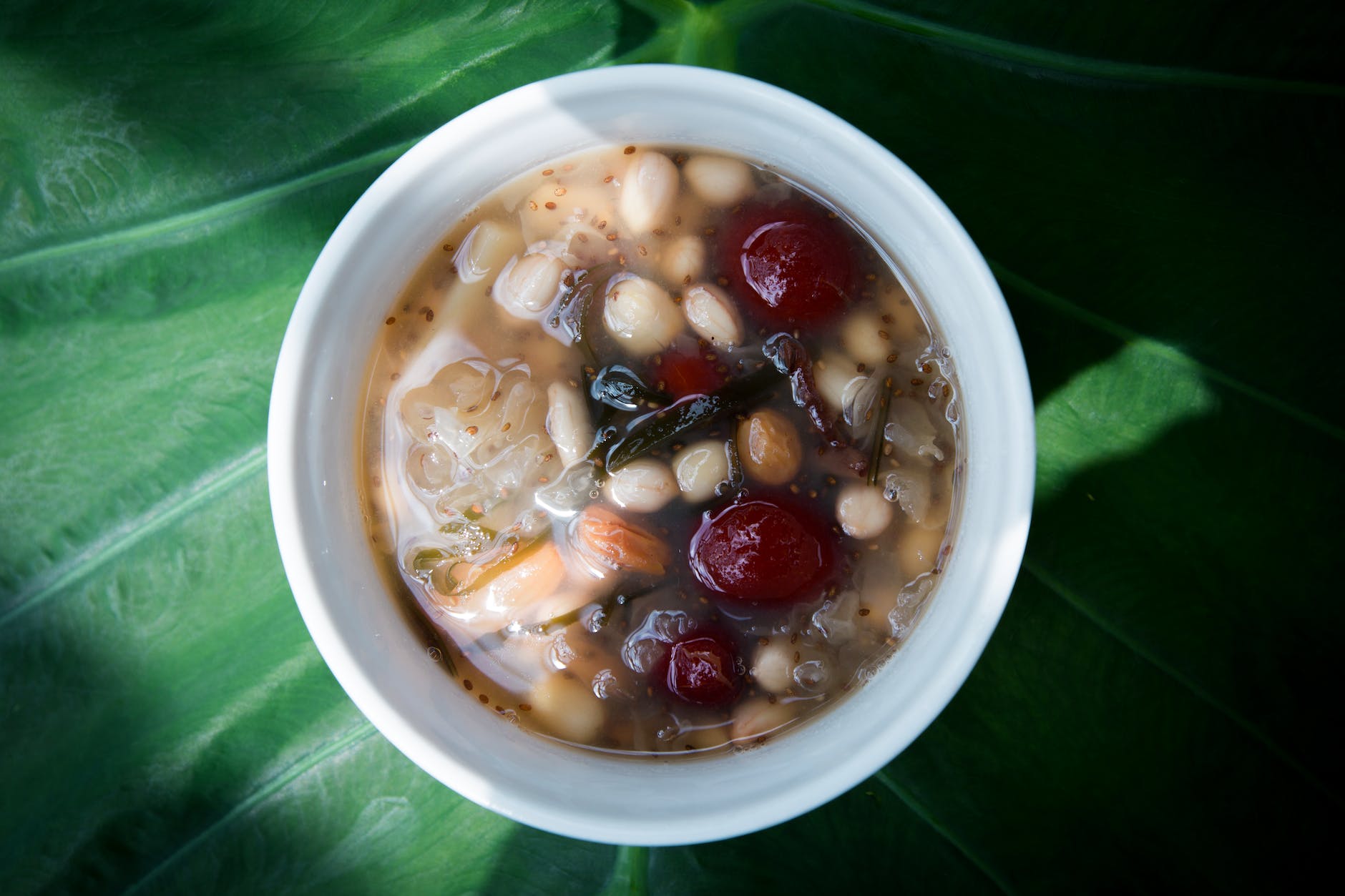 close up photo of a bowl of soup with beans